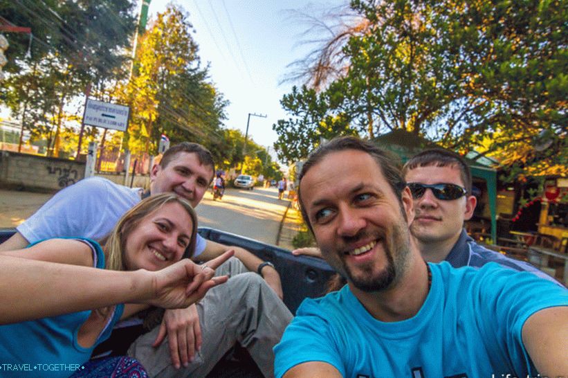 We are hitchhiking in a pickup truck in Thailand