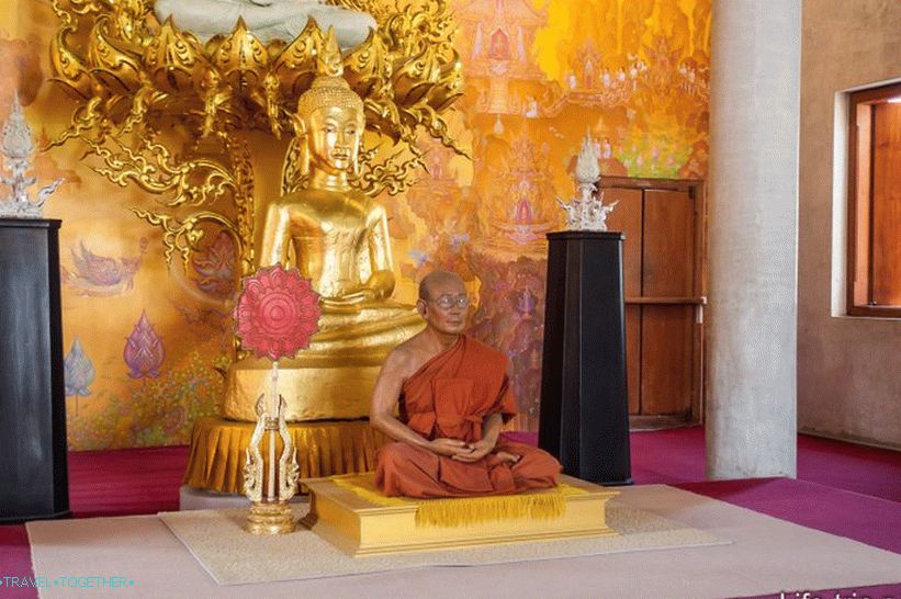 The figure of a monk inside the temple is most likely not a real mummy