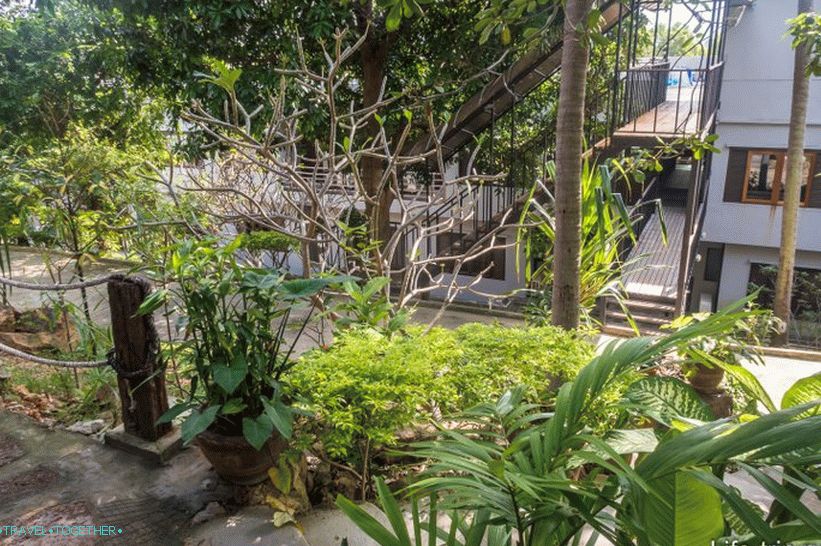 The bridge from the building to the bungalow and pool