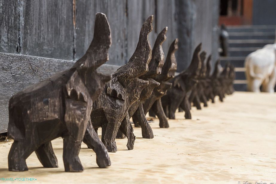 Wooden elephants at the entrance