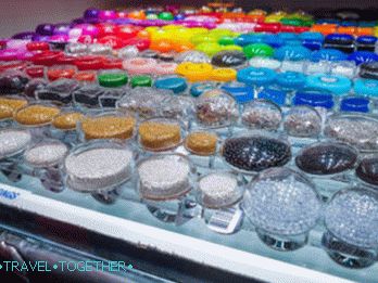 Rings with a scattering of beads and colored liquid