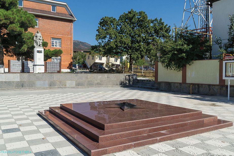 In the background is an inverted house