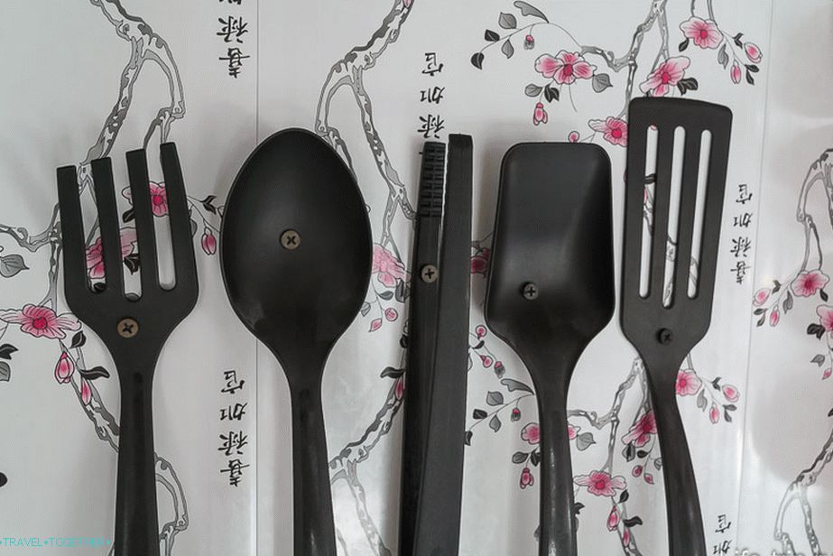 Ladles are screwed to the wall with screws