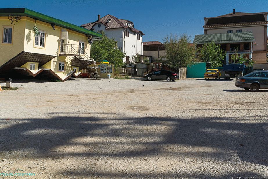 House upside down and parking in front of it