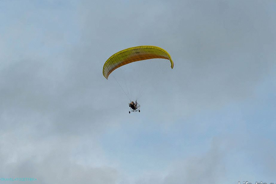 At first the plane wrote out figures, then paragliders