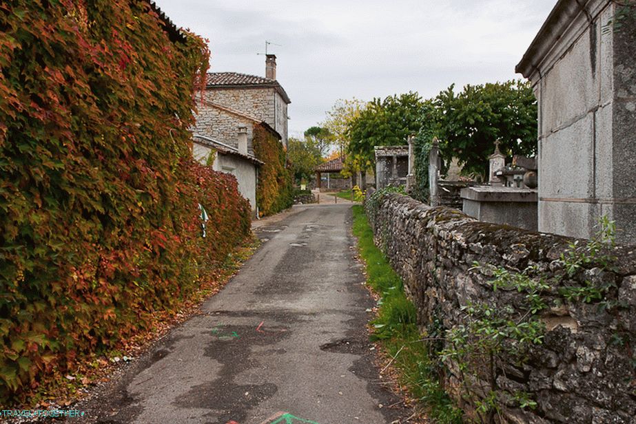 The cemetery is surrounded by a stone fence