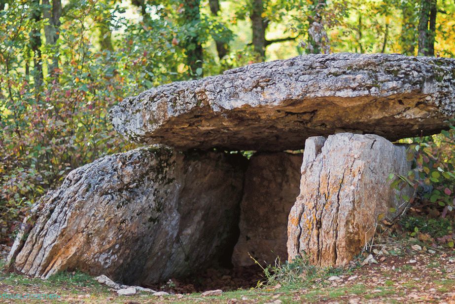 A dolmen stands just in the woods
