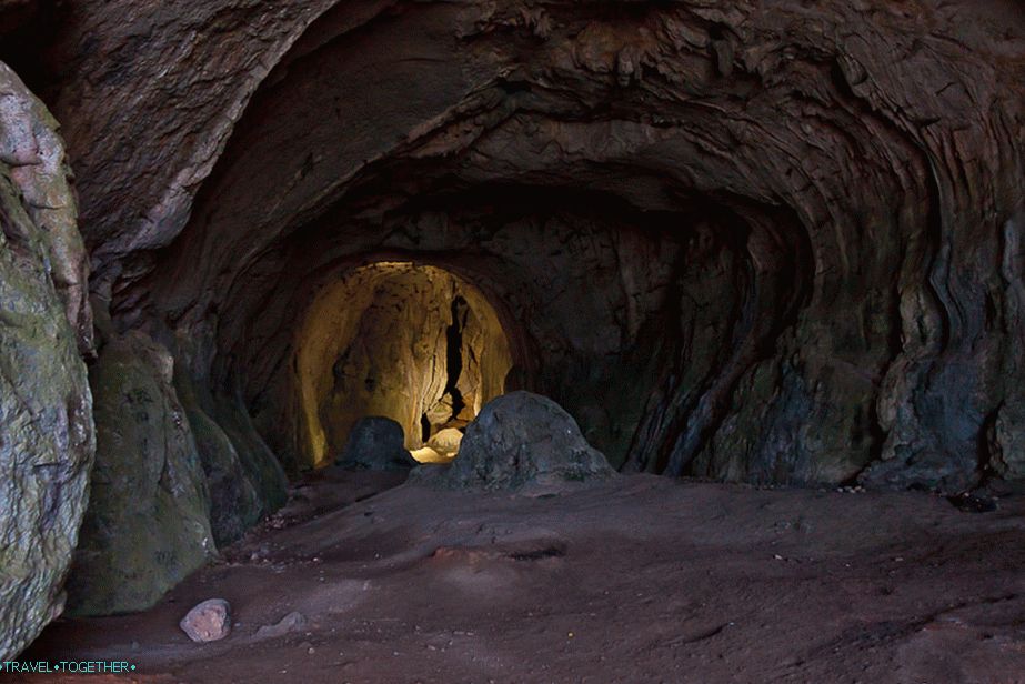 Big cave hall with a window out