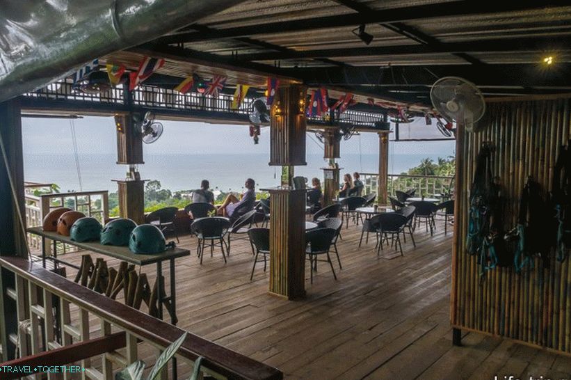 Restaurant and viewing platform; a zip-line gear hangs on the right side of the wall