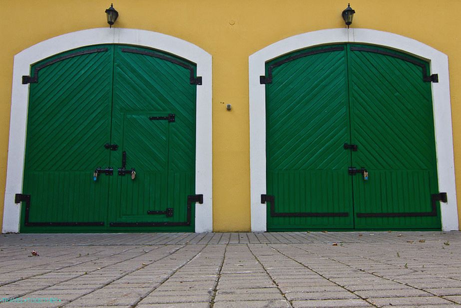 Bright green gate at the outbuilding