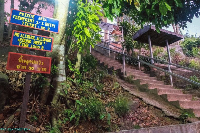 Coming down the concrete stairs, turning back
