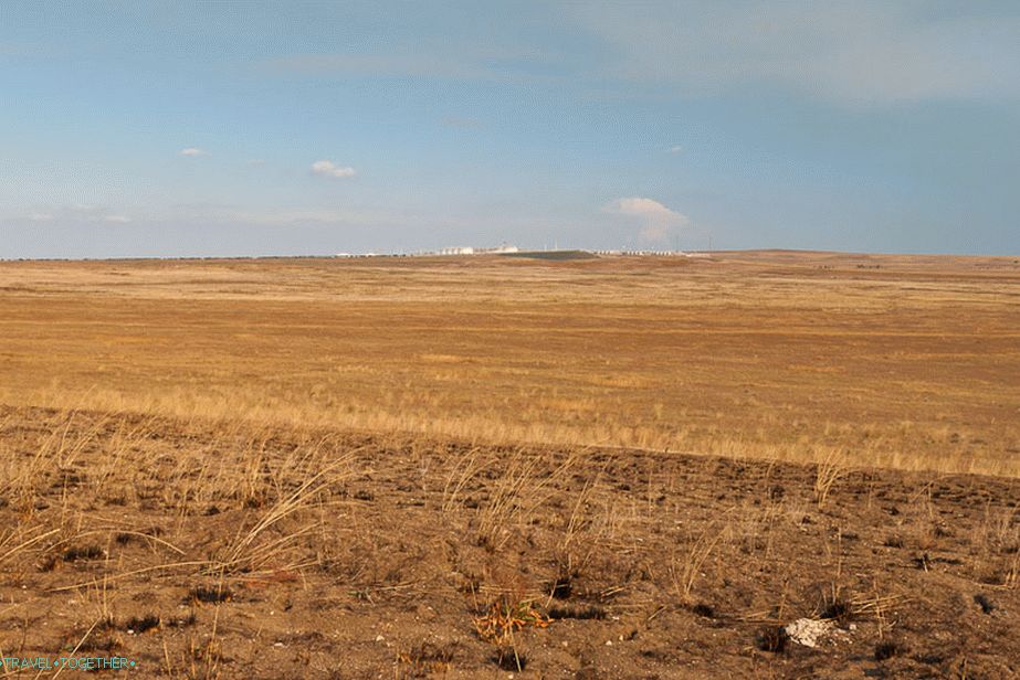 A refinery station can be seen in the distance