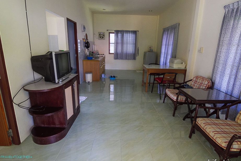 Large living room with kitchen