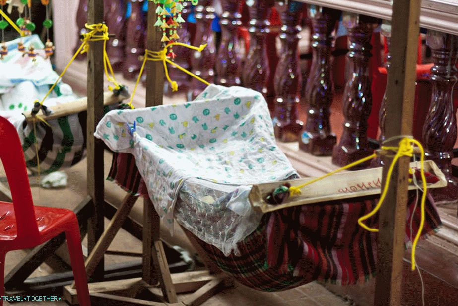 Children sleep right on the waterfront in the cradles