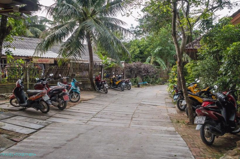 At the end of the road there will be parking, further - on foot through the territory of the resort