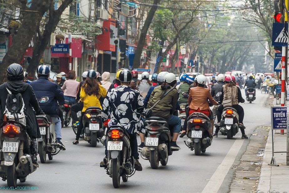 Splashy stream of bikes on the street of Hanoi