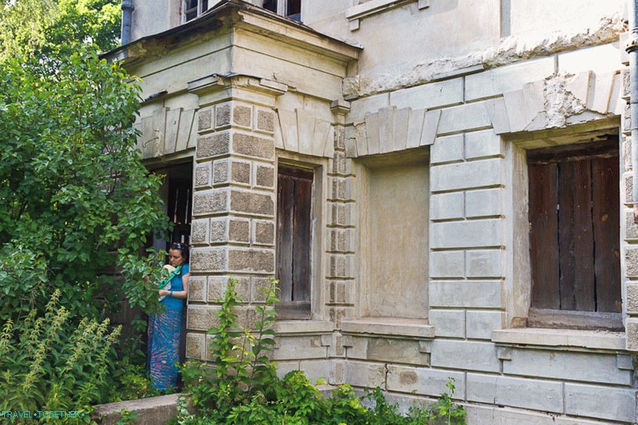 The entrance to the manor house is boarded up with metal sheets