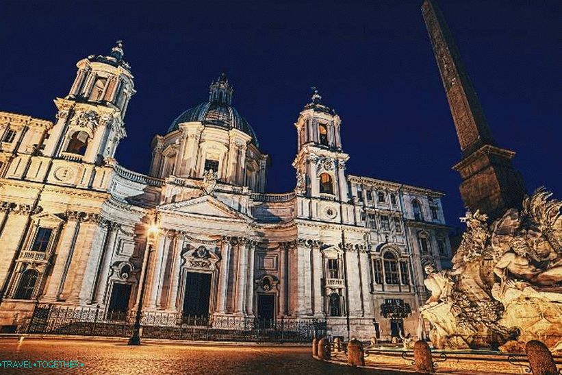 The obelisk of the fountain on the background of the church of Sant'Agnese in Agone
