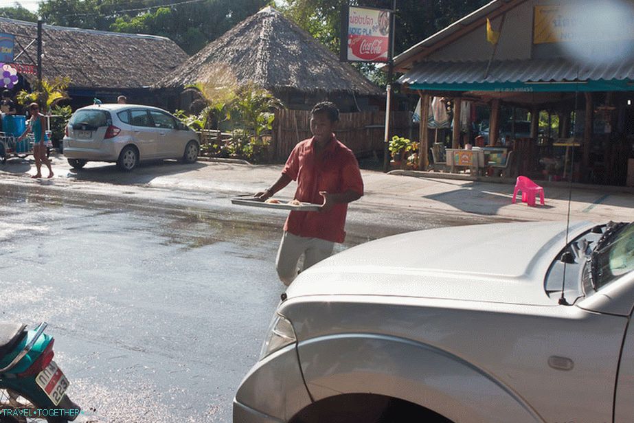 Poor waiters maneuver between water shots