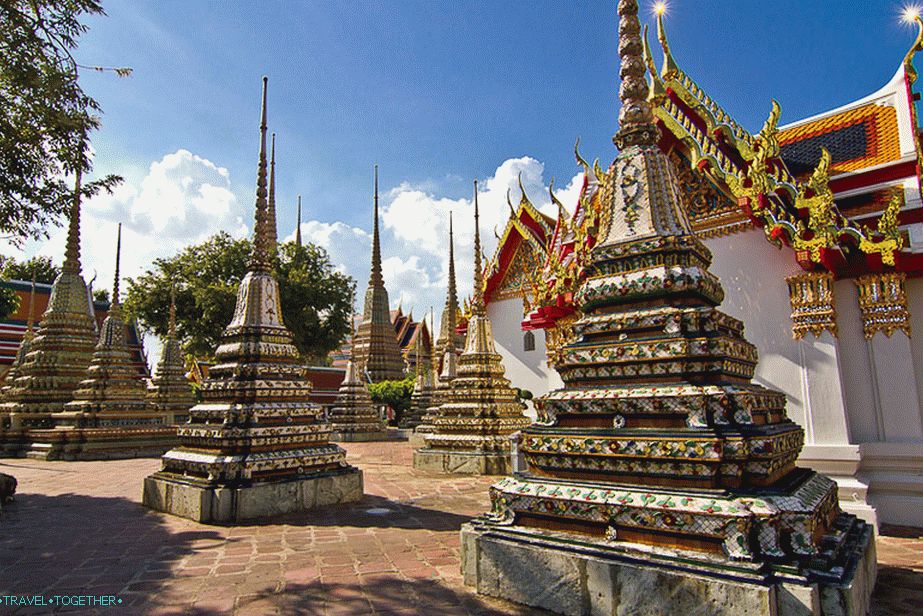 Stupas on the background of glittering roofs