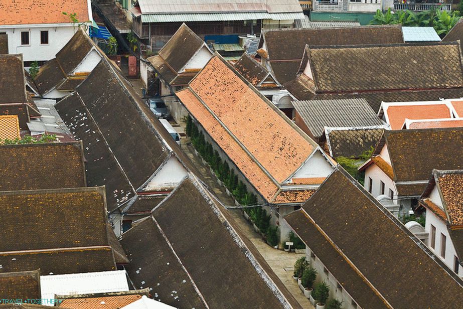 Below the roofs of the other temple buildings