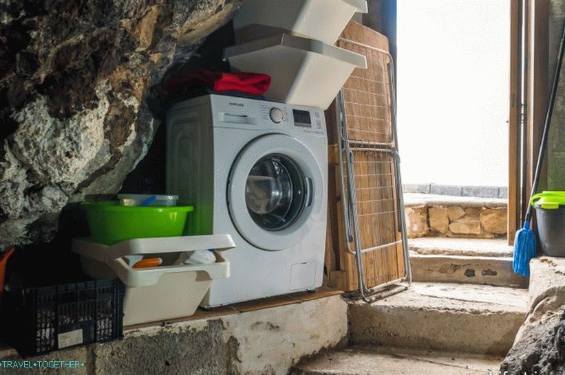 There is a washing machine in a separate cave