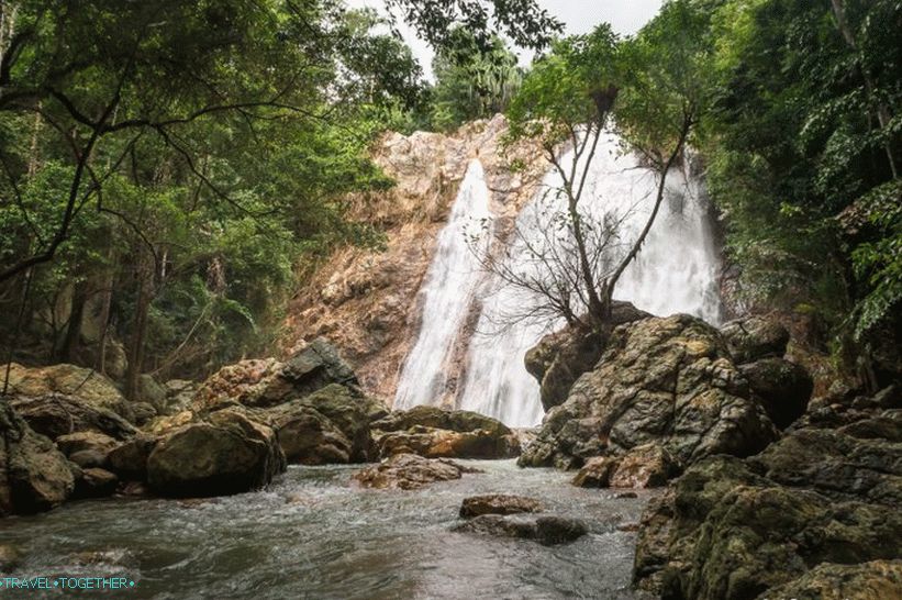 Behind the stone on which the tree grows - a huge font