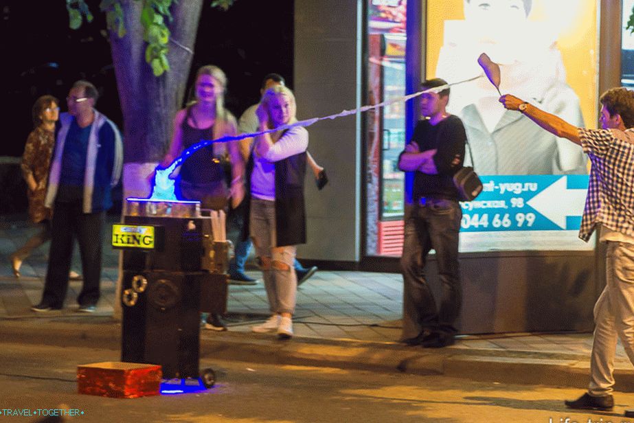 The guy makes cotton candy to the music and dancing
