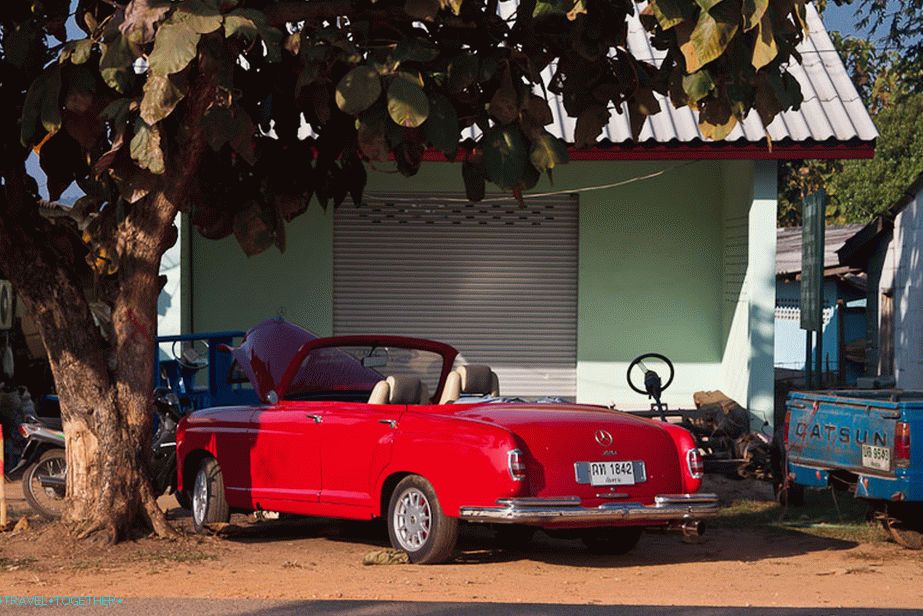Who has such a red Mercedes convertible?